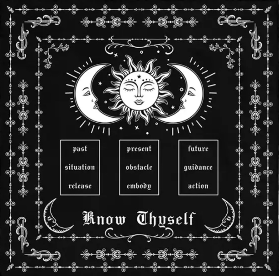 Two crescent moons surround a sun that provide tarot inspiration.