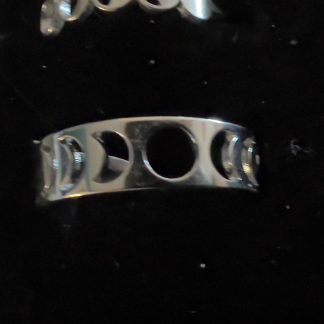 This shows what the Moon Phase Rings look like. The ring is silver with cutouts to demonstrate the phases.